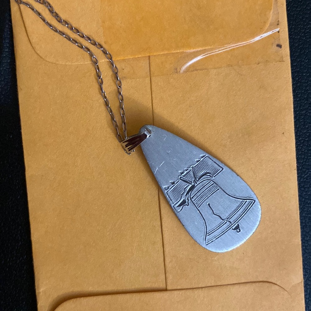 Necklace with bell pendant